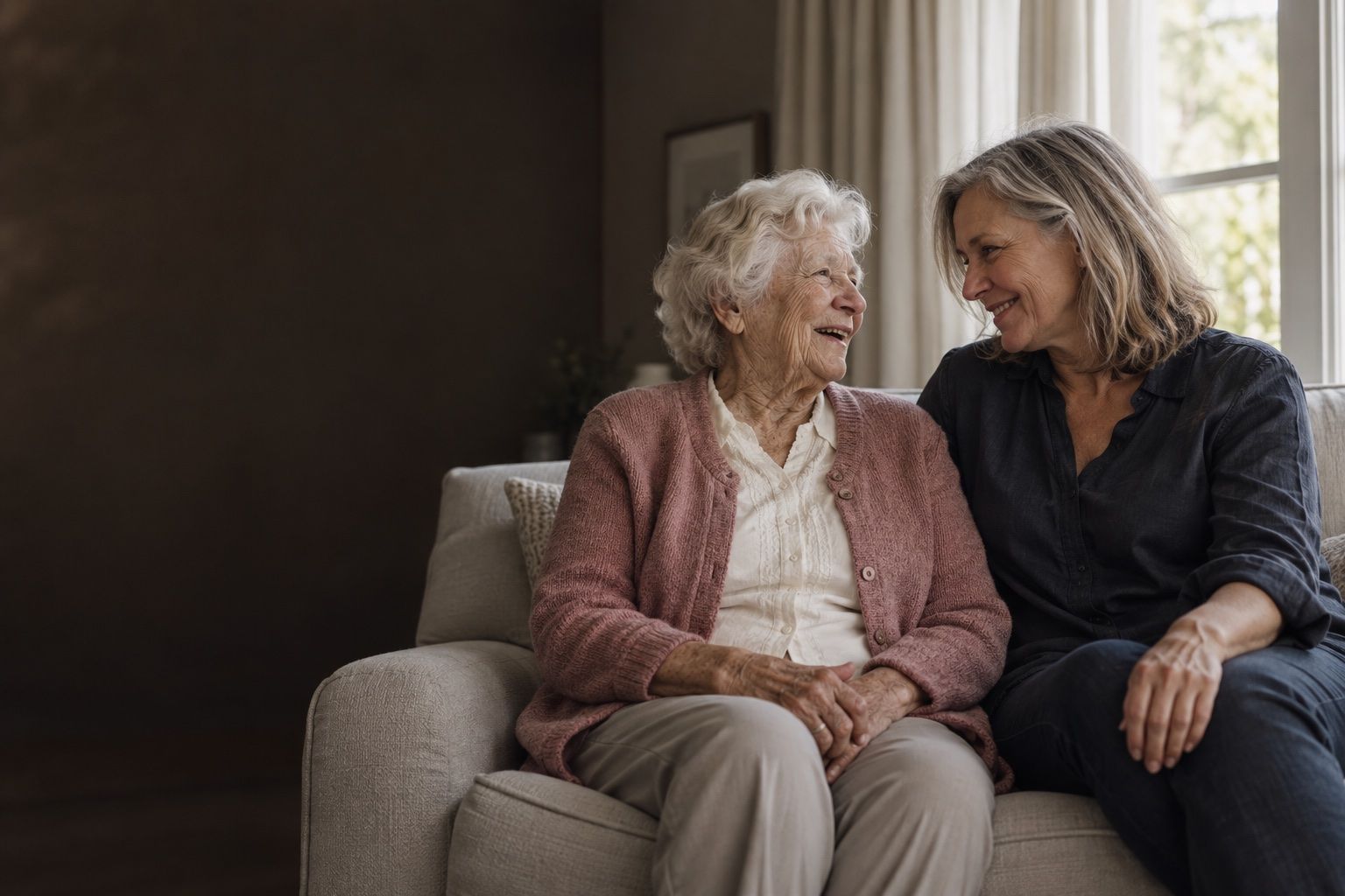 A daughter and her elderly mother sharing a relaxed moment together at home